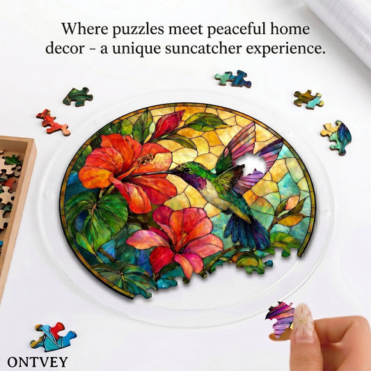 Hands assembling the Hummingbird acrylic jigsaw puzzle suncatcher on a table