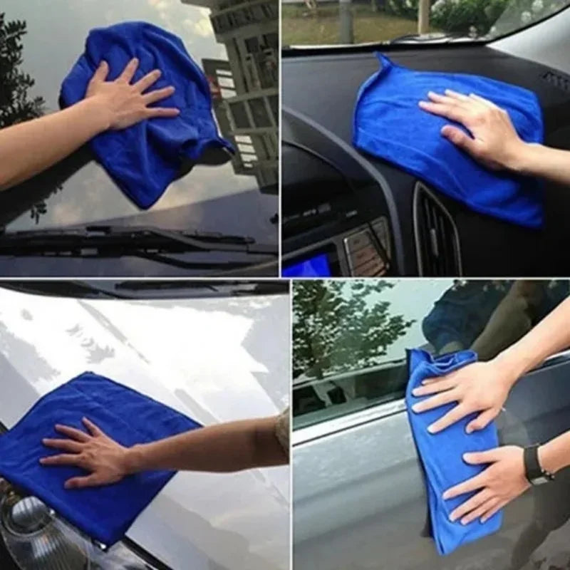 Hands drying and wiping a car with blue microfiber cloths