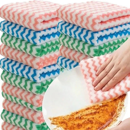 Stack of striped dish cloths in assorted colors next to a hand wiping a plate
