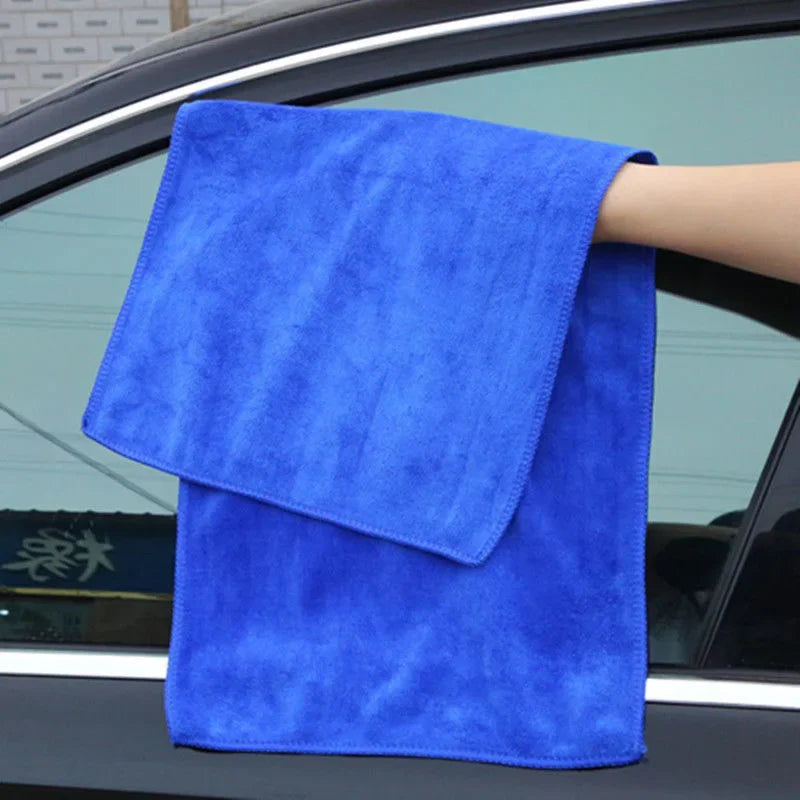 Blue microfiber cloth draped over a car window