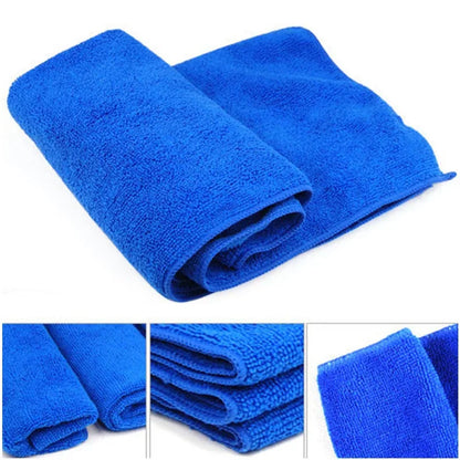 Folded blue microfiber cleaning cloths with close-ups of the soft weave
