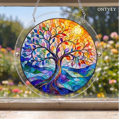 Vivid Tree puzzle suncatcher hanging in a window with a garden behind it