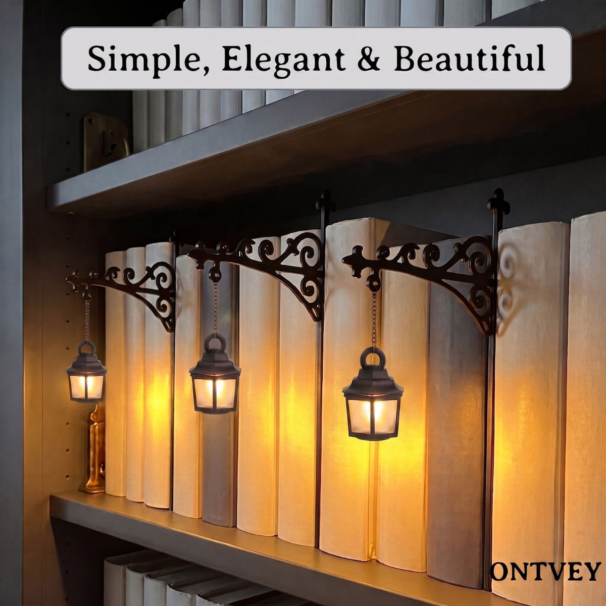 Three lantern lights glowing on a bookshelf
